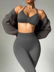 Dewbera Bộ đồ thể thao nữ gồm áo croptop hở lưng và quần legging. - Màu xám đen - Xem 4