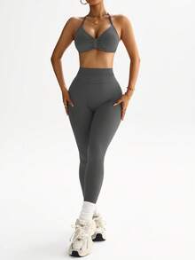 Dewbera Bộ đồ thể thao nữ gồm áo croptop hở lưng và quần legging. - Màu xám đen - Xem 7