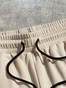 AXEPEAK 宽松男士字母拼接细节撞色滚边抽绳腰短裤 - 杏色 - 查看 3