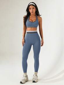 Dewbera Bộ đồ thể thao nữ kẻ sọc, xếp ly, áo croptop cổ yếm và quần legging. - Màu xanh bụi bặm - Xem 5