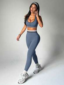 Dewbera Bộ đồ thể thao nữ kẻ sọc, xếp ly, áo croptop cổ yếm và quần legging. - Màu xanh bụi bặm - Xem 2