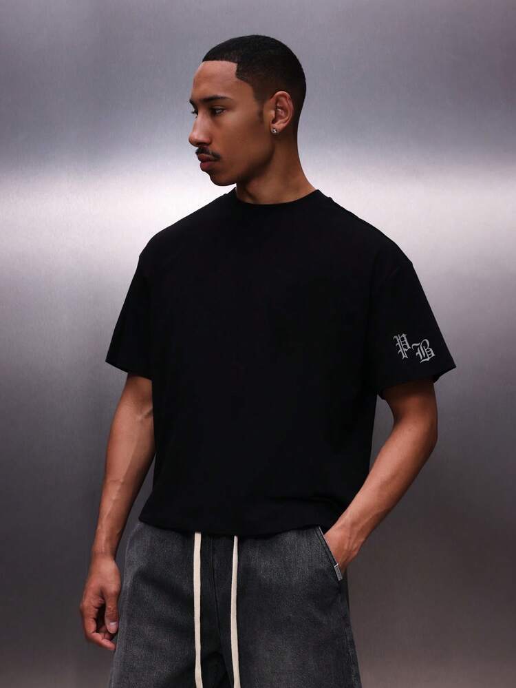 PLAYBOY X SUMWON Men's Black Logo Circular Graphic Crew Neck Short Sleeve Regular Fit Casual Cotton T-Shirt Tee Top