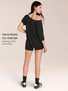 GLOWMODE 2 Pieces Tencel™ Modal 4.3''Asymmetric Relaxed Off-Shoulder Tee & 4.3" FeatherFit™ Buttery-Soft Crossover Biker Shorts Gym Cycling Running - Black - View 2