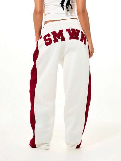 SUMWON WOMEN Pantalones de chándal de pierna ancha y suelta con cordón, con detalles de rayas laterales y aplicaciones para comodidad casual, Copa Mundial