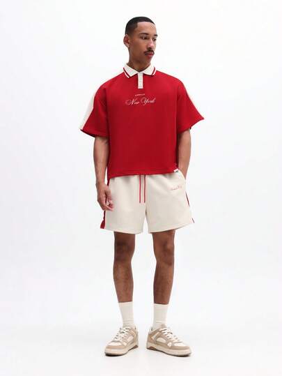 SUMWON Conjunto de polo y pantalones cortos con texto bordado de Nueva York y cintura elástica a juego para hombres oversize