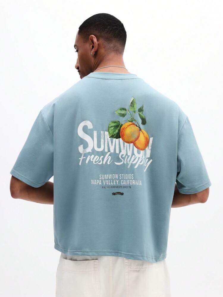 Camiseta de algodón relajada con cuello redondo de manga corta, ajuste boxy, estampado gráfico de melocotón fresco de verano para hombre