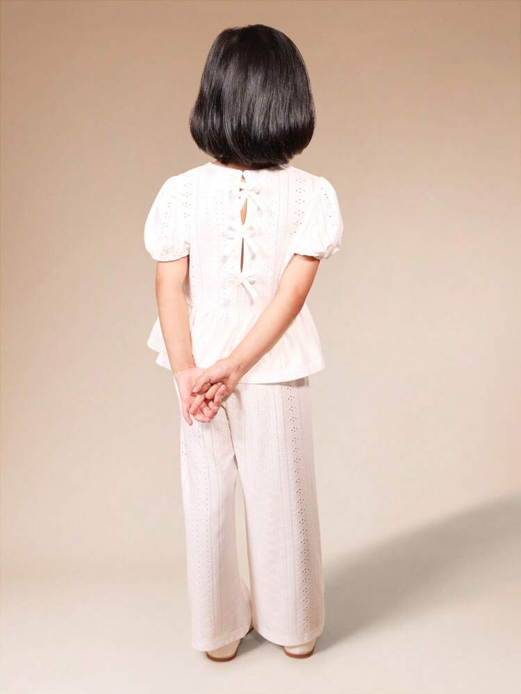 Ensemble haut péplum en dentelle et pantalon palazzo