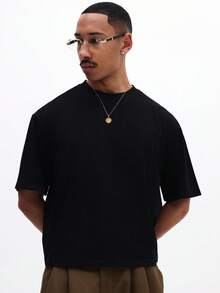 SUMWON Camiseta de algodón de cuello redondo de manga corta con diseño de texto impreso en la espalda, corte relajado para hombre - Negro - Ver 4