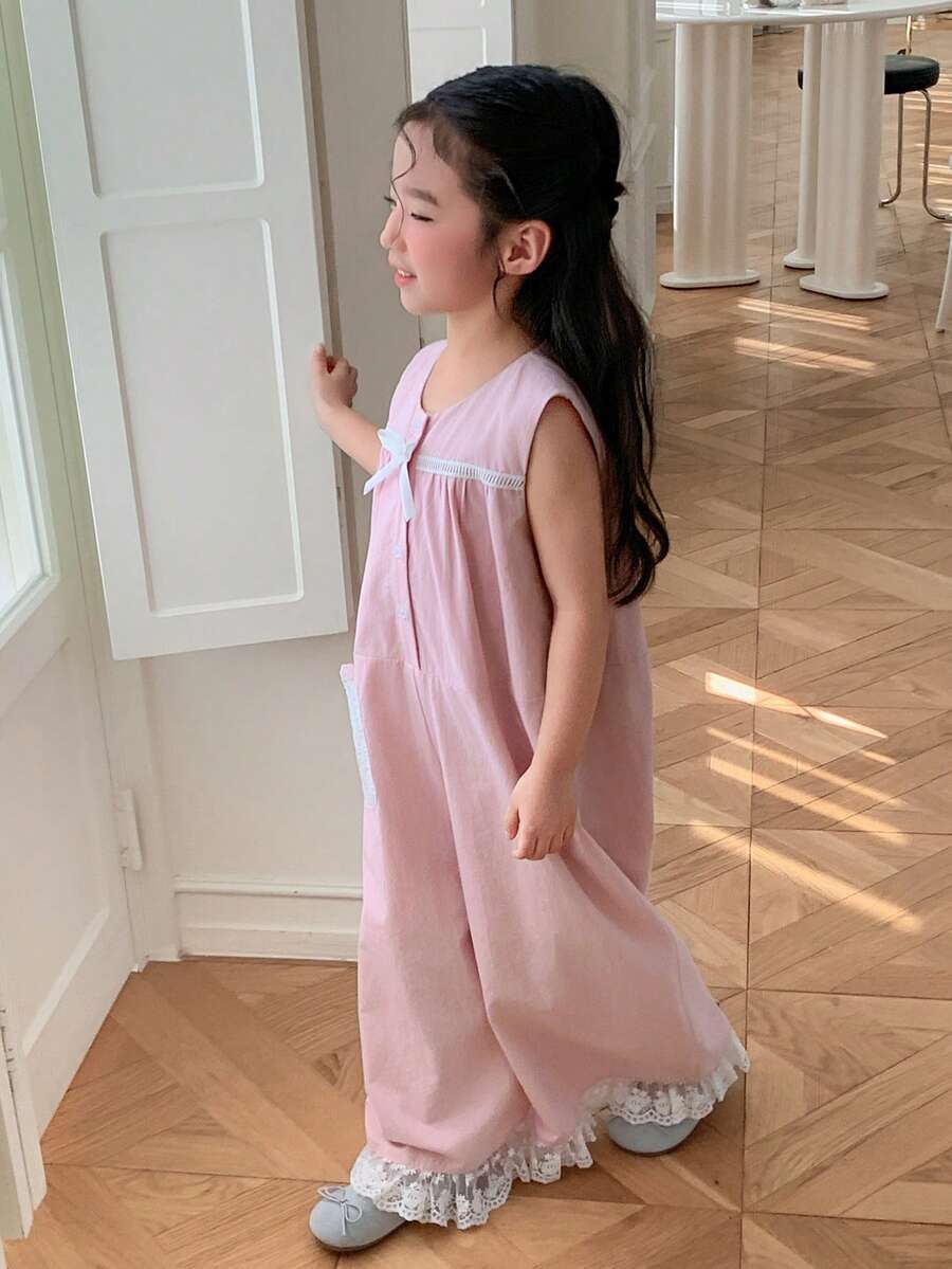 Dazy Kids Mono holgado de pierna ancha sin mangas con decoración de lazo y botones de media cartera para niña en verano - Rosa - Ver 1