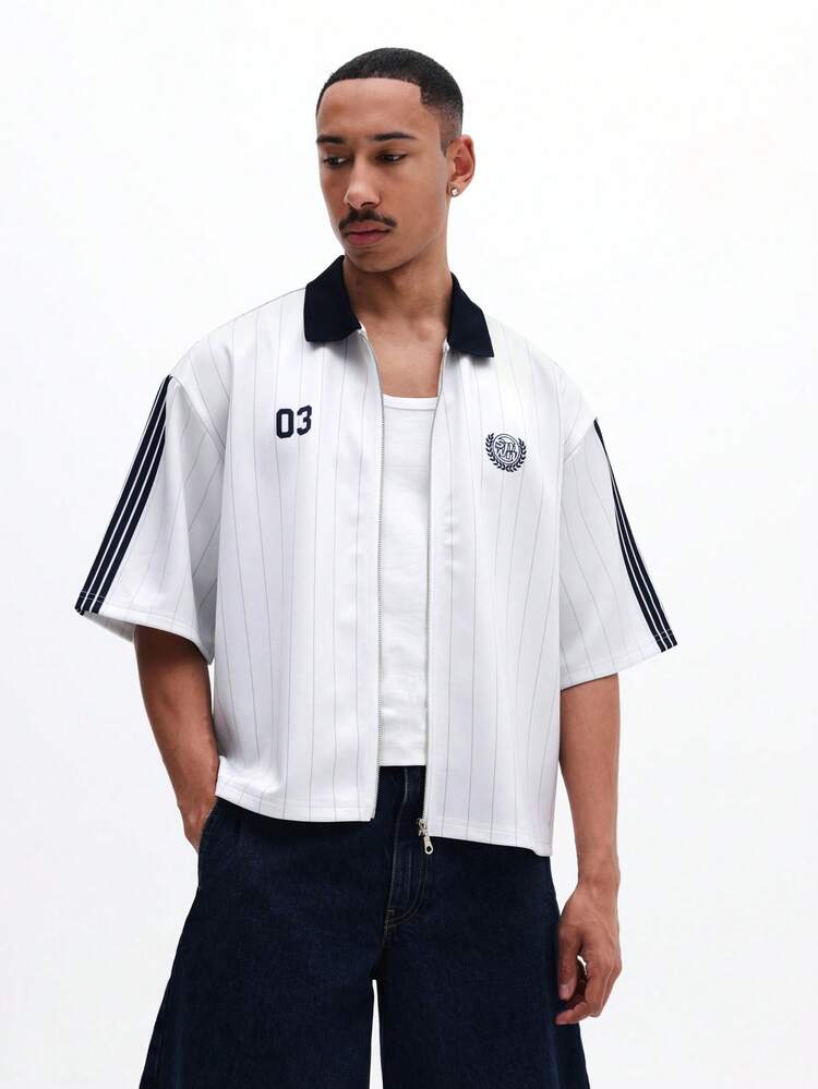 Polo extragrande con cremallera y estampado de rayas