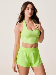 Core Rhythm Top deportivo corto sin espalda de unicolor con cuello halter - verde fluorescente - Ver 6
