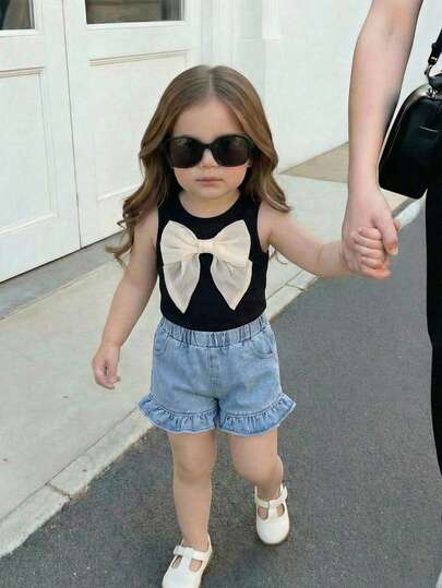 SHEIN Baby Girls' Summer Vest With Bow Tie And Denim Ruffle Shorts Set 2pcs/Set Baby Girl Round Neck Short Sleeve Bow Printed T-Shirt And Embroidered Bow Denim Shorts Set Suitable For Spring/Summer Baby Girl Clothes, Toddler Girl Clothes Baby Girl Clothes Sets Summer Infant Girl Short Sleeve Outfits Baby Girl Rainbow Outfit Toddler Sets Summer Baby Casual Sets