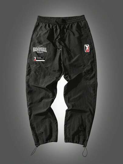 Manfinity Sport Corelite Pantalones casuales versátiles para uso diario y deportes al aire libre con estampado de letras y cordón en la cintura para hombres