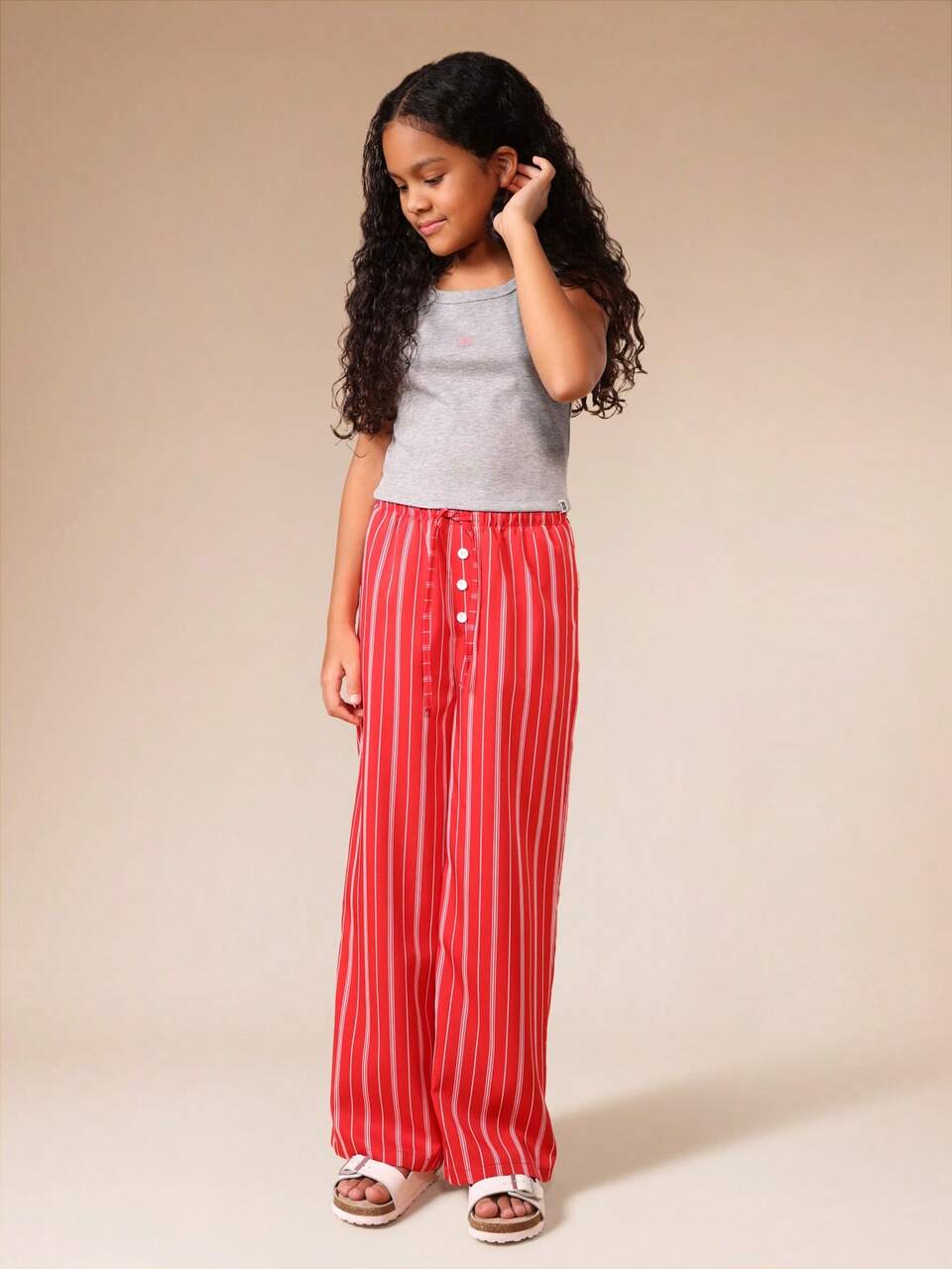 Conjunto de regata canelada com calça pantalona listrada