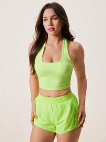 Core Rhythm Top deportivo corto sin espalda de unicolor con cuello halter - verde fluorescente - Ver 5