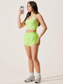 Core Rhythm Top deportivo corto sin espalda de unicolor con cuello halter - verde fluorescente - Ver 8