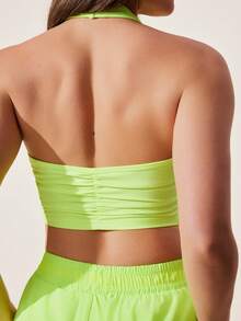 Core Rhythm Top deportivo corto sin espalda de unicolor con cuello halter - verde fluorescente - Ver 2