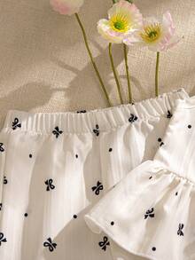 Souflis Souflis 2pcs Baby Girls' Milky White Delicate Black Print Sleeveless Ruffled Collar Shirt With Bow Decor And Elastic Waist Pants Set, Comfortable And Cute For Spring, Summer And Autumn Baby Girls Elegant Outfit Baby Girls Summer Outfit Sleeveless Top And Pants Set - White - View 10