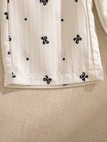 Souflis Souflis 2pcs Baby Girls' Milky White Delicate Black Print Sleeveless Ruffled Collar Shirt With Bow Decor And Elastic Waist Pants Set, Comfortable And Cute For Spring, Summer And Autumn Baby Girls Elegant Outfit Baby Girls Summer Outfit Sleeveless Top And Pants Set - White - View 11