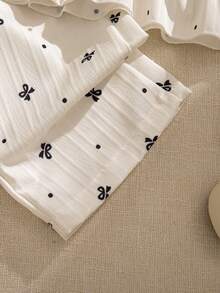 Souflis Souflis 2pcs Baby Girls' Milky White Delicate Black Print Sleeveless Ruffled Collar Shirt With Bow Decor And Elastic Waist Pants Set, Comfortable And Cute For Spring, Summer And Autumn Baby Girls Elegant Outfit Baby Girls Summer Outfit Sleeveless Top And Pants Set - White - View 9