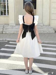 SHEIN Tween Girl Elegant White And Black Contrast Bow Mini Dress, Tween Girl Summer Birthday Party Dress, Ruffle Strap Cap Sleeve Backless Casual Dress - Black and White - View 7