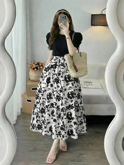 两件套：少女夏季优雅时尚连衣裙，黑色圆领泡泡袖短袖上衣，腰带设计，搭配经典黑色碎花长裙。适合日常穿着、购物、聚会及其他场合。