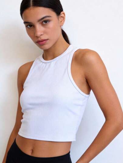 Top deportivo corto de licra unitalla (30 a 32), sin mangas y cuello redondo, ideal para entrenar, yoga, gym o actividades fitness cómodamente