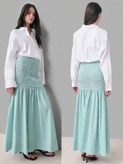 Nöista Green And White Striped Maxi Skirt With Smocked Waist-To-Hip Panel And Flowing Gathered Hem. Lightweight And Comfortable, Perfect For Spring And Summer Outfits, Casual Chic Styling, And Effortless Everyday Wear.