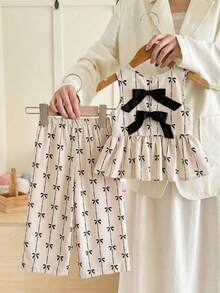 SHEIN LMoss Kids 女童蝴蝶结印花碎花无袖上衣和宽松休闲裤套装两件套 女童碎花套装 女童两件套碎花套装 女童半身裙套装 碎花半身裙套装 女童碎花半身裙套装 蝴蝶结上衣套装 女童套装 女童服装套装 女童半身裙套装 碎花半身裙套装两件套 幼儿 - 杏色 - 查看 2