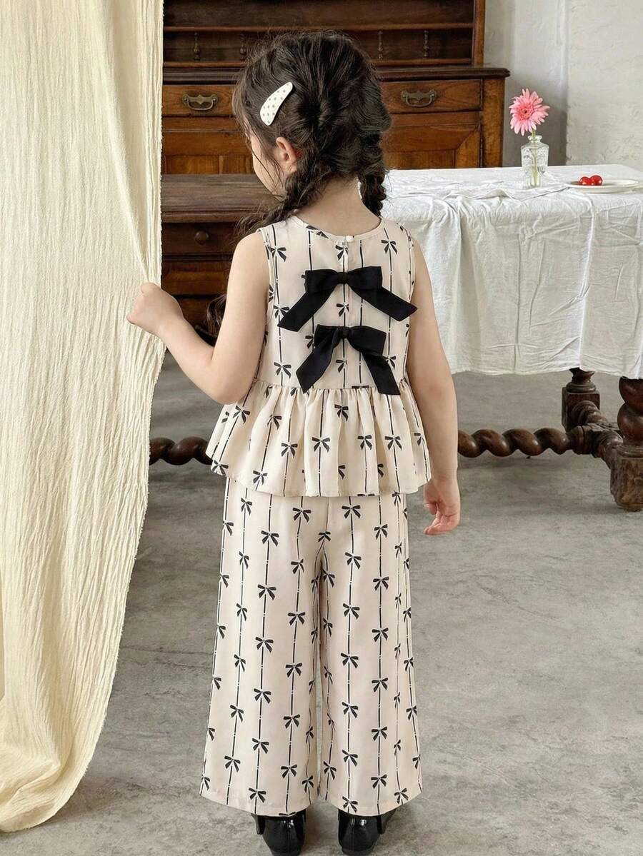 SHEIN LMoss Kids 女童蝴蝶结印花碎花无袖上衣和宽松休闲裤套装两件套 女童碎花套装 女童两件套碎花套装 女童半身裙套装 碎花半身裙套装 女童碎花半身裙套装 蝴蝶结上衣套装 女童套装 女童服装套装 女童半身裙套装 碎花半身裙套装两件套 幼儿 - 杏色 - 查看 1