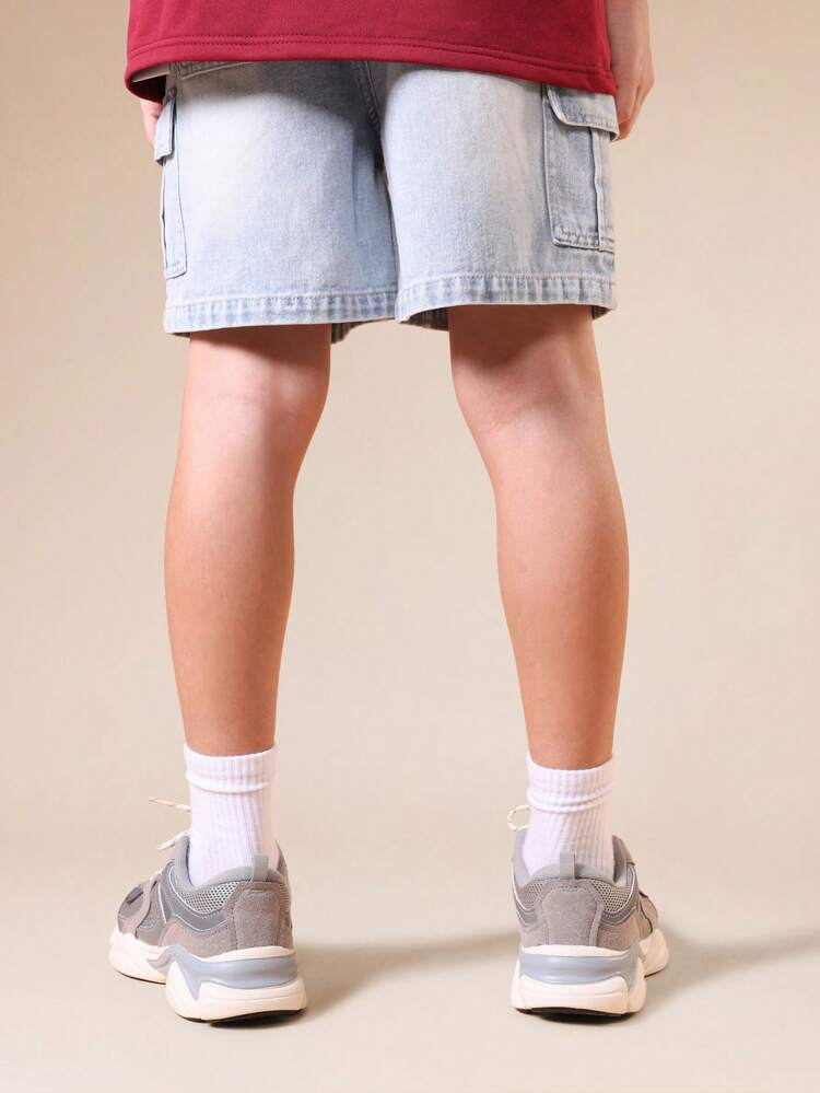 Pantaloncini in denim cargo con lavaggio vintage e tasche
