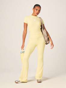 Missguided x Playboy High Rise Cross Over Waist Flared Leggings With White Bunny Logo For Activewear - Yellow - View 2