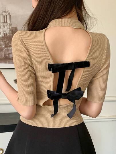 FRIFUL Maglia da donna con scollo rotondo, schiena scoperta, decorazione fiocco e lavorazione traforata, sexy