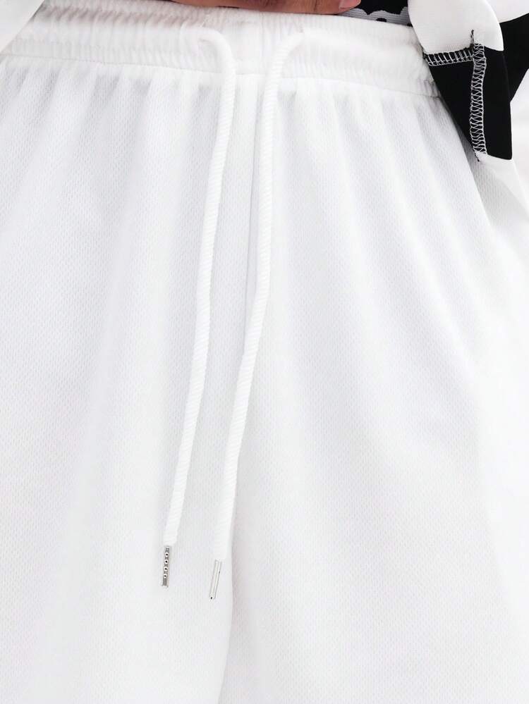 Short blanc à bandes latérales noires