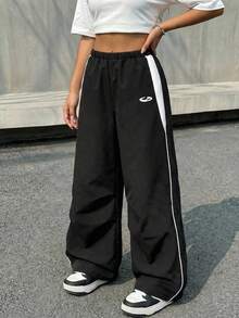 SHEIN Quần dài dệt kim dáng rộng phối màu đen trắng tương phản, kiểu dáng thường ngày, phù hợp cho bé gái tuổi teen, thích hợp cho mùa xuân, hè, thu và đông, đa năng cho mặc hàng ngày, thể thao và phong cách đường phố. - màu đen - Xem 1