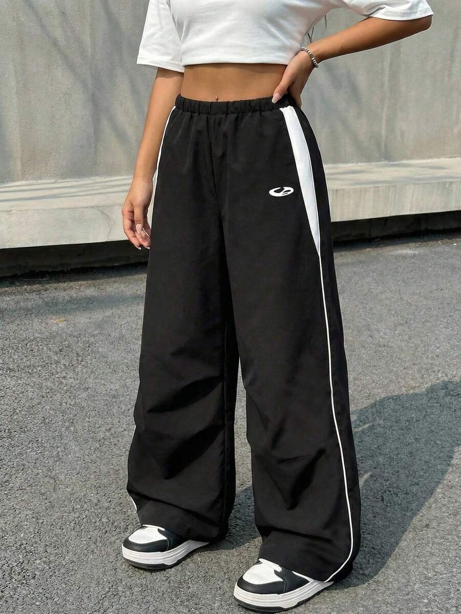 SHEIN Quần dài dệt kim dáng rộng phối màu đen trắng tương phản, kiểu dáng thường ngày, phù hợp cho bé gái tuổi teen, thích hợp cho mùa xuân, hè, thu và đông, đa năng cho mặc hàng ngày, thể thao và phong cách đường phố. - màu đen - Xem 1