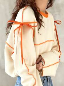 FRIFUL Áo thun dài tay nữ dáng rộng cổ tròn phối màu tương phản có nơ - Màu be - Xem 3