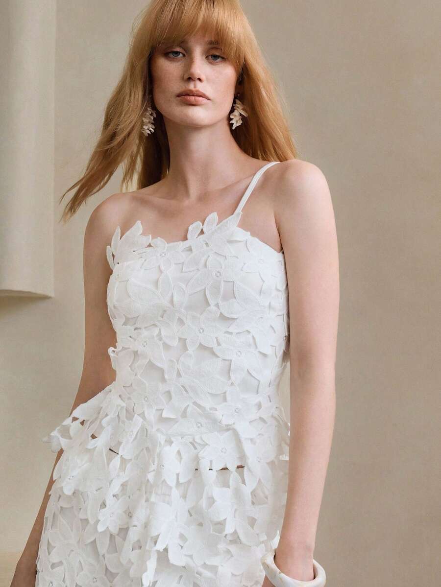 Arave Women's Fitted Hollow Floral Asymmetric Sleeveless Waist Cinched Asymmetrical Hem Casual Commuter Top - White - View 1