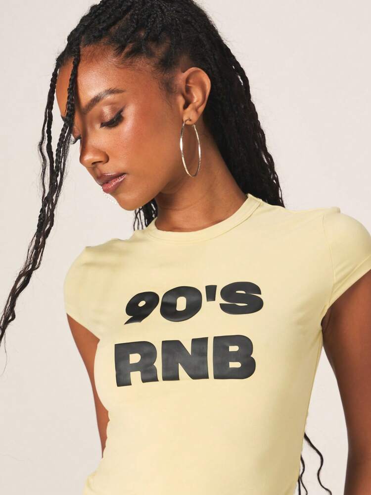 MISSGUIDED Women's 90s RnB Nostalgia Baby Tee Short Sleeve Crew Neck Casual Yellow Statement Top With Bold Typography Print Vintage Y2K Inspired Summer Fashion Essential
