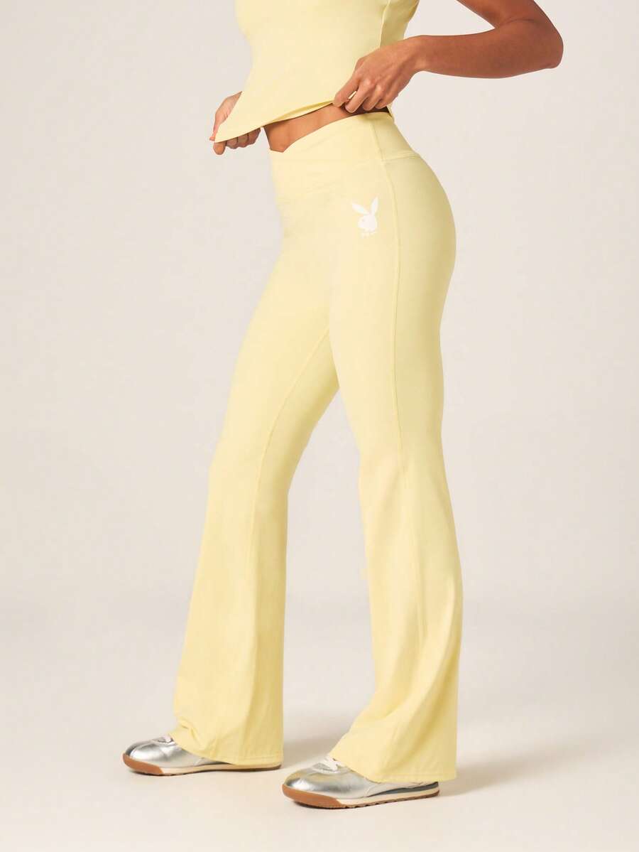 Missguided x Playboy High Rise Cross Over Waist Flared Leggings With White Bunny Logo For Activewear - Yellow - View 1