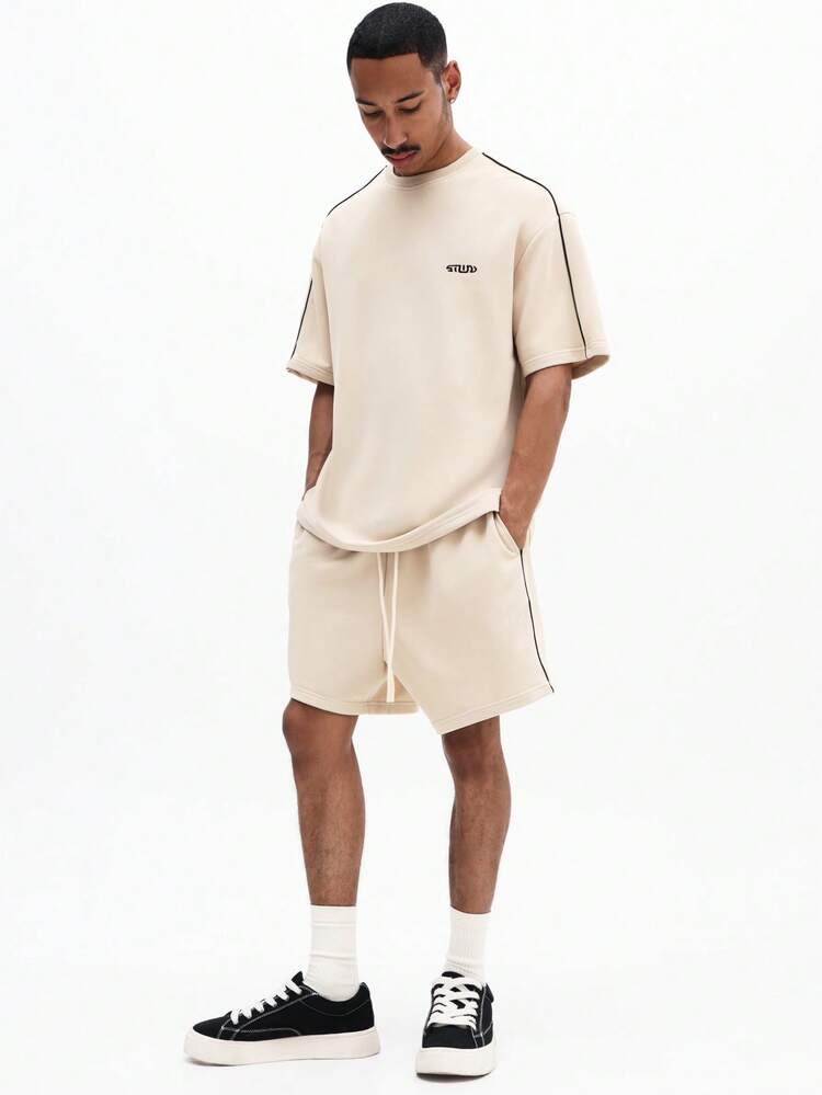 Set coordinato di t-shirt oversize a maniche corte con profili e pantaloncini con dettagli a contrasto