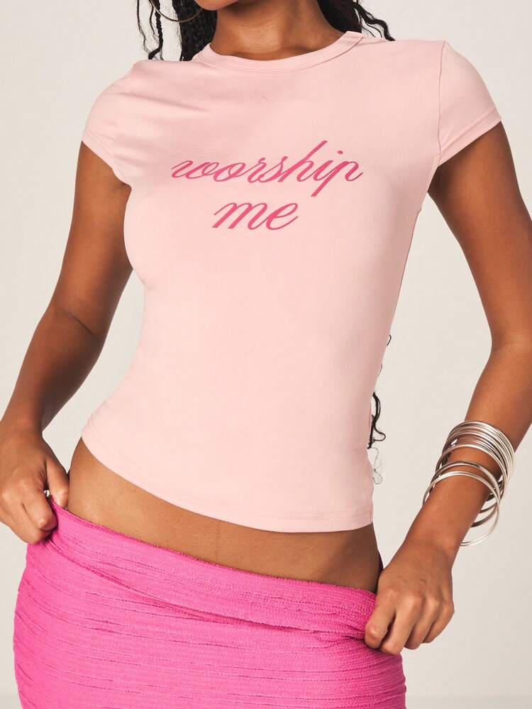 MISSGUIDED Worship Me Script Baby Tee Short Sleeve Fitted Pink Crew Neck Summer Top Casual Everyday Wear Cute Text Print Fashion Statement Piece