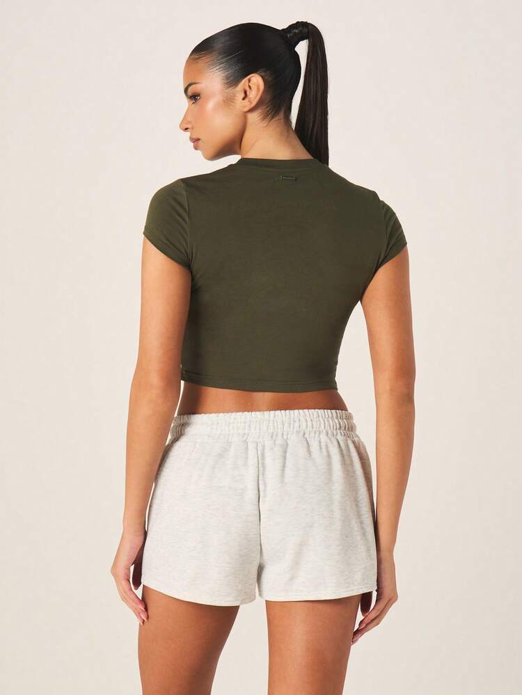 Missguided x Playboy Camiseta corta de mujer de cuello redondo de manga corta con texto impreso, ajustada y con estampado gráfico en color verde oliva - Verde - Añade 2