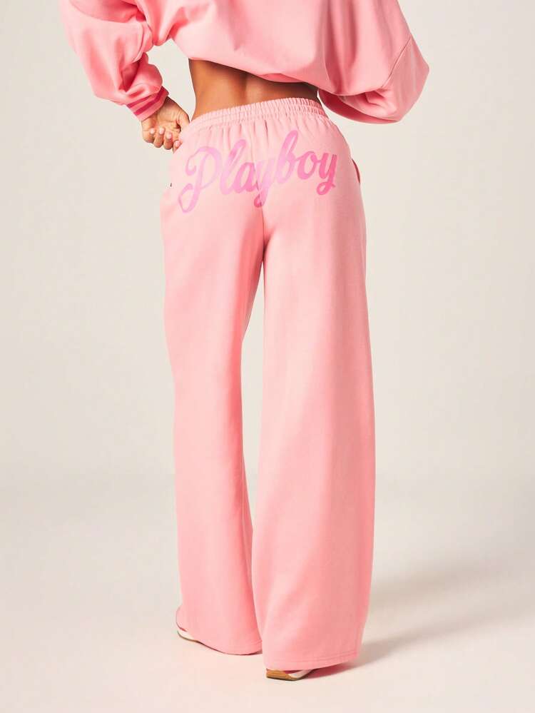 Missguided x Playboy Pantalon de jogging ample à taille haute en velours rose avec logo script et taille élastique pour le loungewear