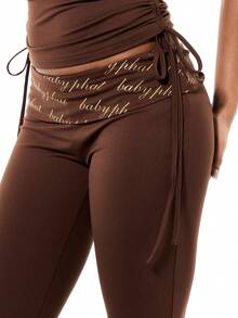 BABYPHAT Women's High Rise Fold Over Waist Printed Script Flare Bell Bottom Leggings With Tie Details - Brown - View 4