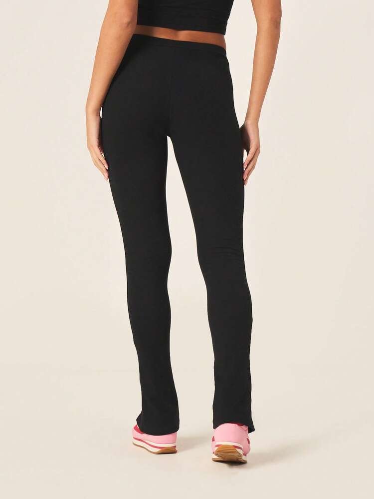 Missguided x Playboy Leggings noirs à fente latérale pour femmes avec logo lapin, taille haute, longueur intégrale, stretch, pantalon de détente casual pour le confort et le style
