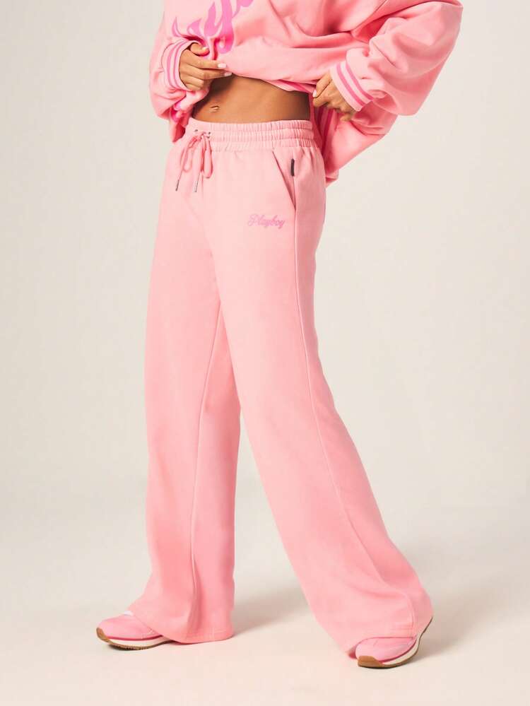 Missguided x Playboy Pantalon de jogging ample à taille haute en velours rose avec logo script et taille élastique pour le loungewear