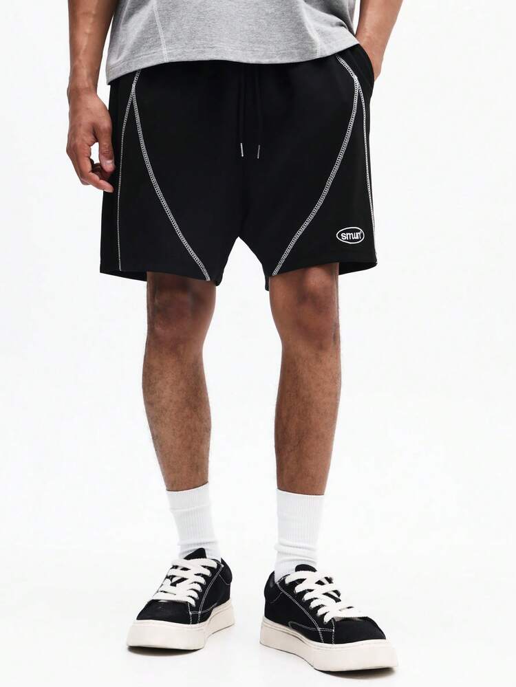 Pantaloncini neri con coulisse e cuciture a contrasto