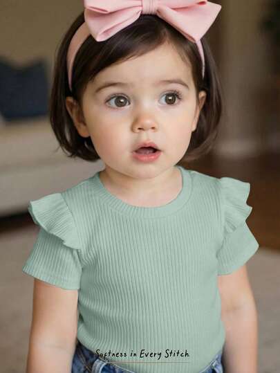 Cozy Pixies Blusa de punto suave con cuello redondo y mangas cortas con volantes, unicolor, para niña bebé