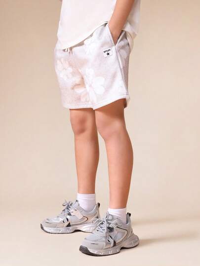 SUMWON Pantalones cortos de jersey con estampado floral para niños preadolescentes con bolsillos laterales, cintura elástica con cordón, ajuste cómodo y relajado, para usar en vacaciones y la playa